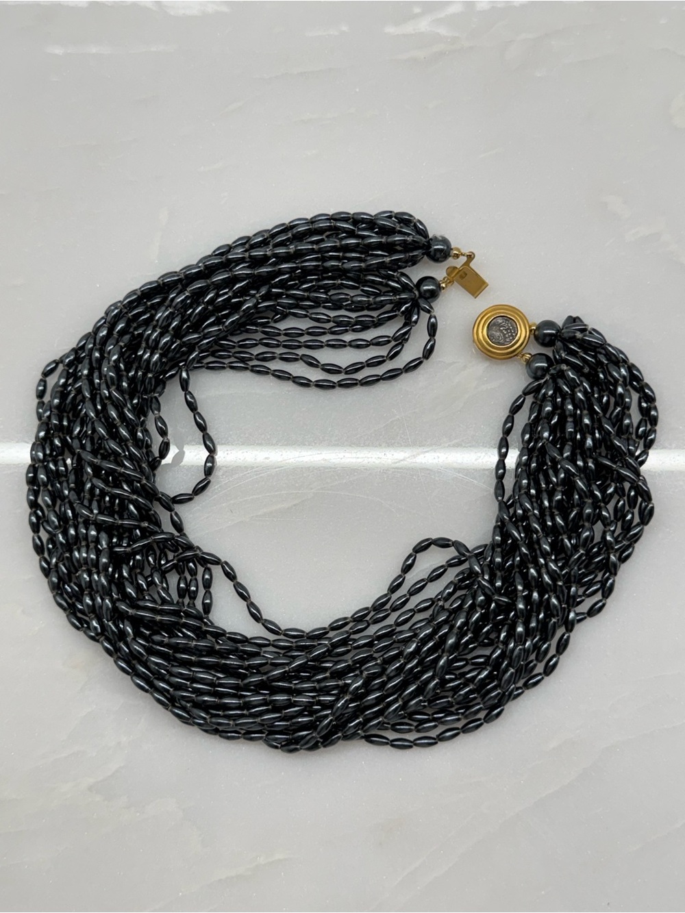 Vintage 24-Strand Hematine Choker Necklace Ancient Greek Coin Clasp 15"